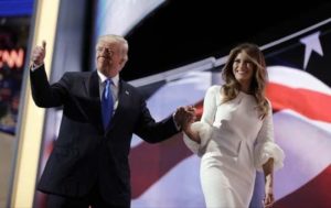Republican presidential candidate Donald Trump gives his thumb up as he walks off the stage with his wife Melania during the Republican National Convention, Monday, July 18, 2016, in Cleveland. (AP Photo/John Locher)