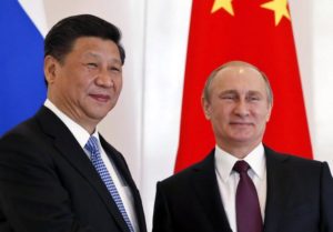 epa05026327 Russian President, Vladimir Putin (R), poses with Chinese President, Xi Jinping (L), during the BRICS leaders' meeting prior to the G20 summit in Antalya, Turkey, 15 November 2015. In addition to discussions on the global economy, the G20 grouping of leading nations is set to focus on Syria during its summit this weekend, including the refugee crisis and the threat of terrorism.  EPA/YURI KOCHETKOV